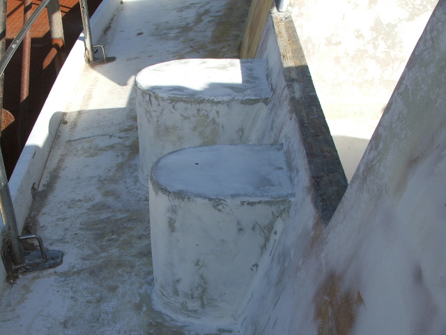 Winch bases fitted and glassed in. Fairing to make them smooth has started
